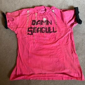 Small vintages 80s tshirt. Size small, no tag, does have small holes.